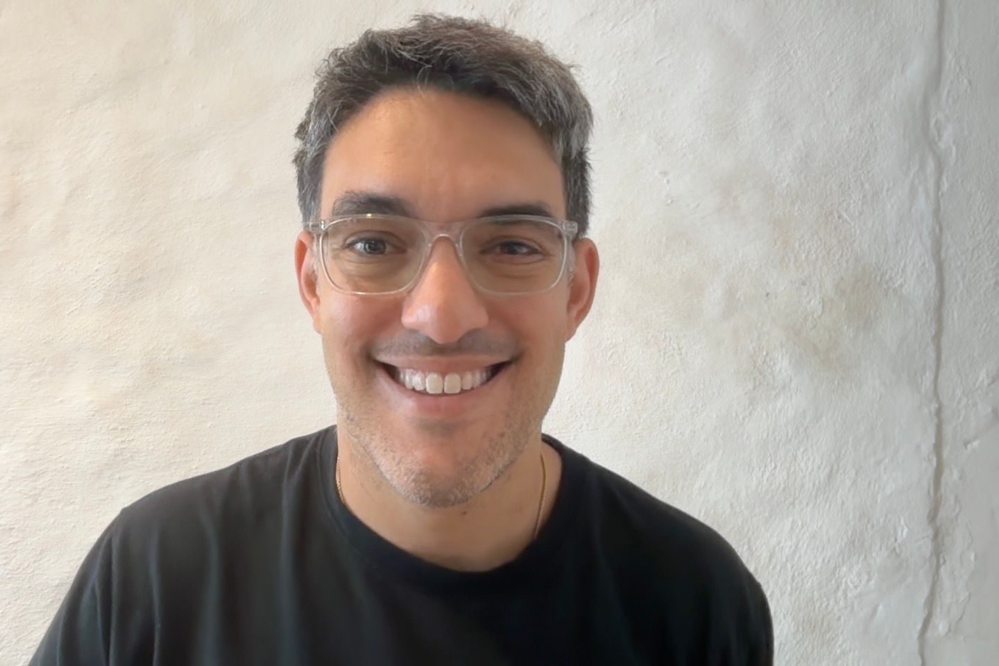 Ari, your English tutor, smiling